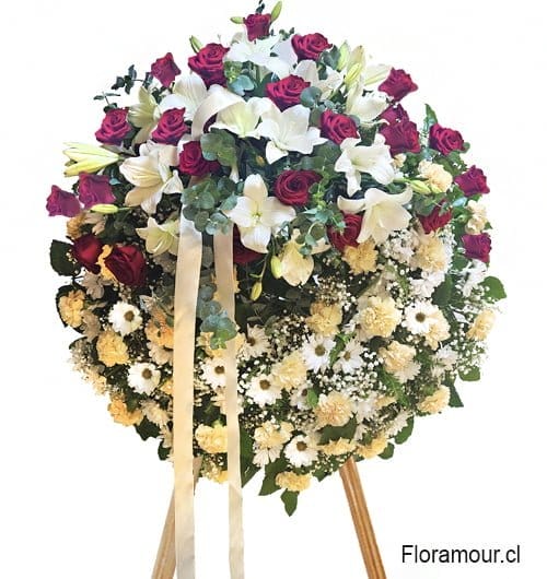 Corona de flores para funeral montada en atril